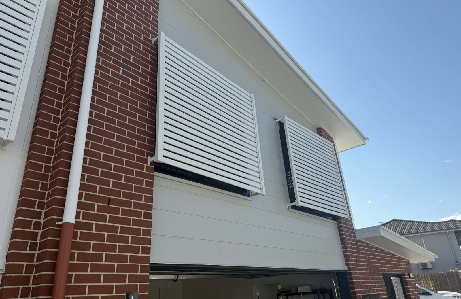 New cladding and louvre screens on a brick townhouse
