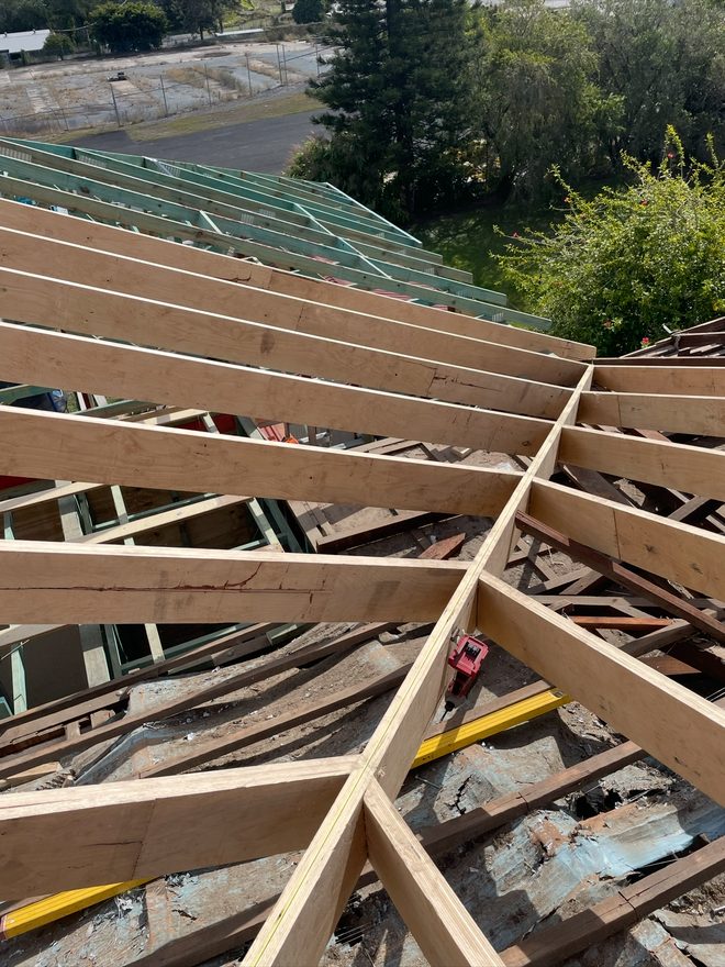 New roof trusses and framing timber on a Brisbane roof replacement