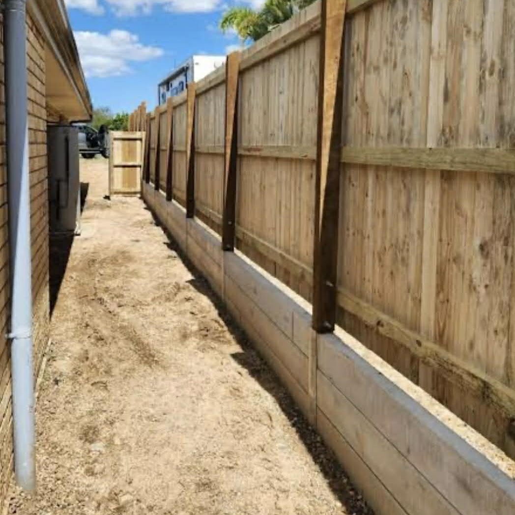 New timber fence with bracing built along a side path