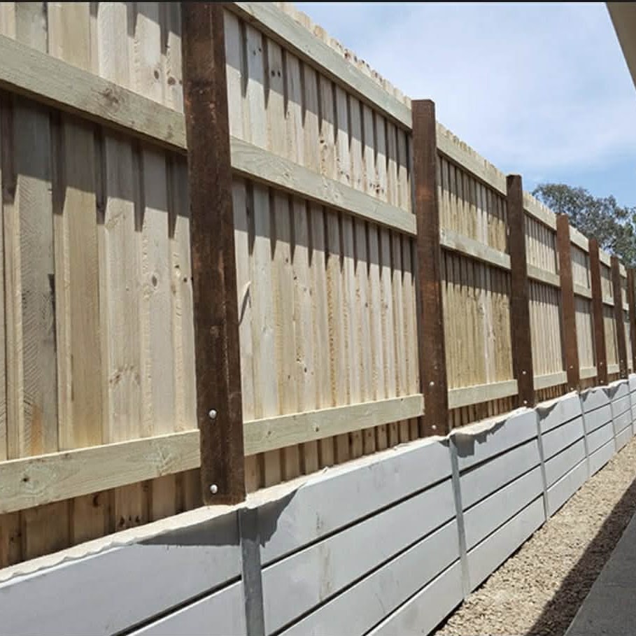 New timber paling fence on a sleeper wall